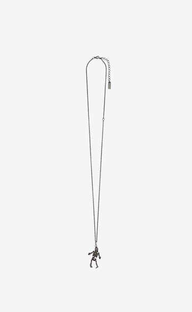 Skeleton charm pendant in metal